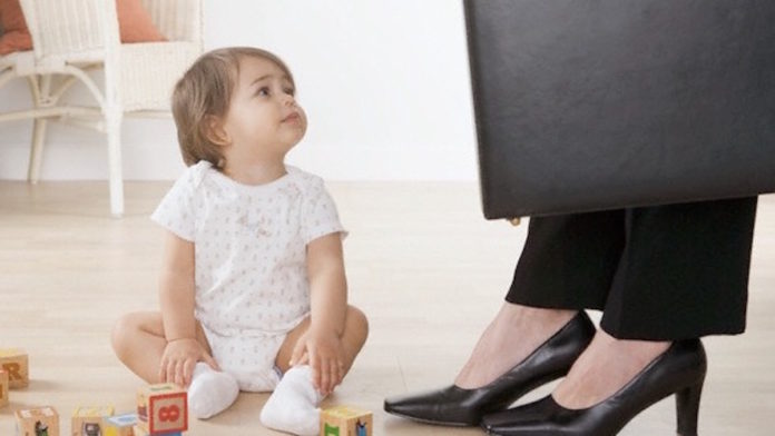 Toddler Girl Looking at Working Mom