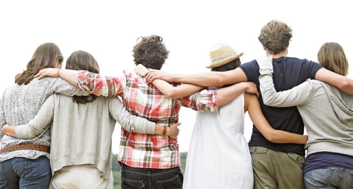 Rear View of Group of Friends Hugging
