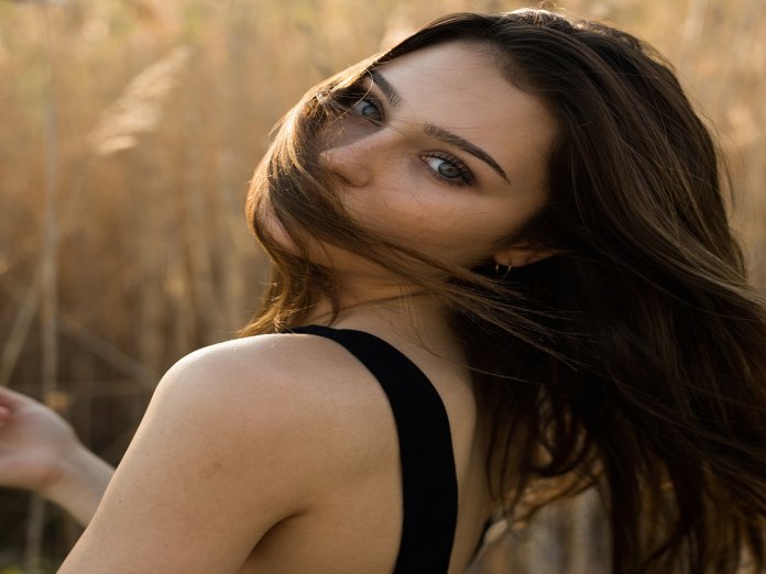 Carefree hair flowing with the golden reeds