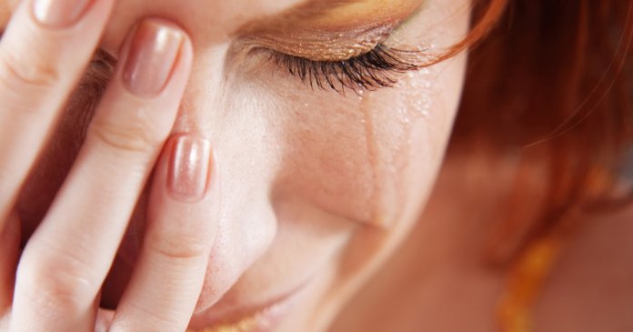 Closeup of crying woman with tears