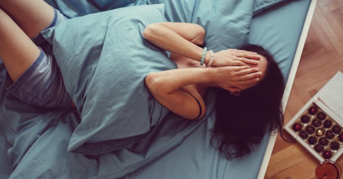 Girl crying in bed