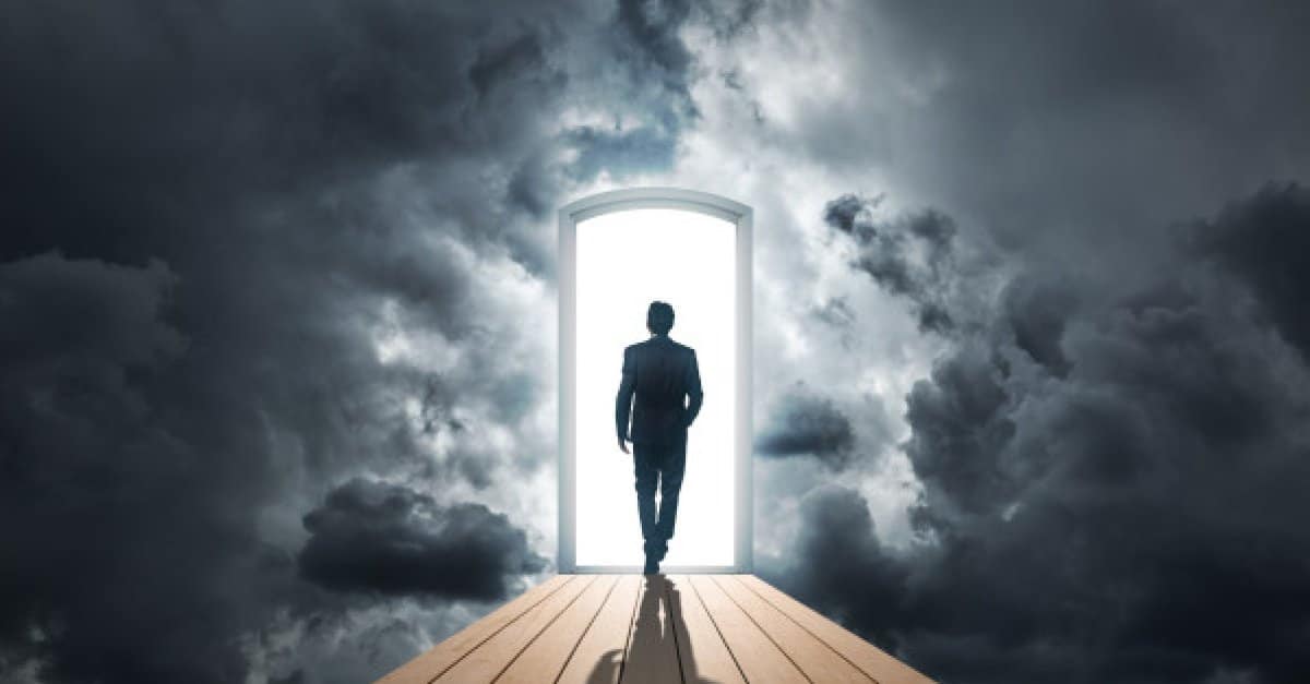 Businessman walking in door for the future
