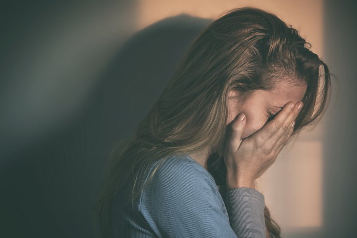 Woman sitting alone and depressed