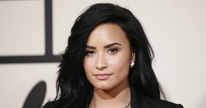 Singer Demi Lovato arrives at the 58th Grammy Awards in Los Angeles