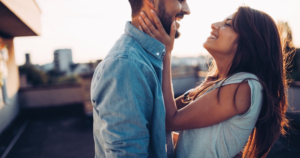 Beautiful couple in love dating outdoors and smiling